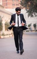 young businessman walks down the street