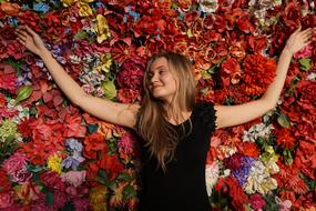 Girl at wall of Flowers