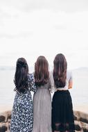 photo of three girlfriends with long hair