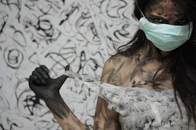 creative photo of a dirty girl with a medical mask
