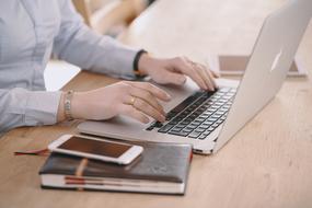 hands of Woman Working at laptop