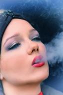 photo portrait of a girl with smoke from the mouth