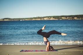 woman meditates by the sea