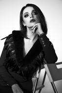 beautiful brunette posing on a chair