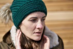 portrait of a woman in green hat