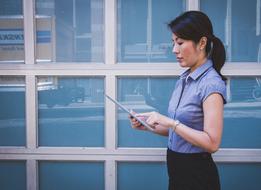Asian woman with the tablet for business