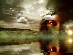 girl in the clouds above the lake as a fantasy
