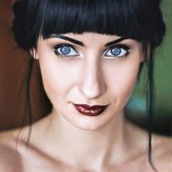 portrait of a girl with blue eyes and dark hair