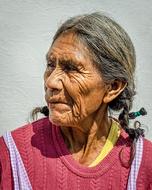 elderly woman with wrinkles and ponytails