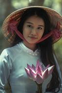 photo of asian girl with pink lotus