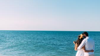 newlyweds on the shores of the turquoise sea