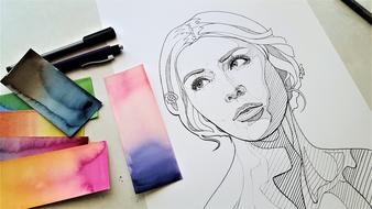 female portrait, Drawing and colorful Paper on table