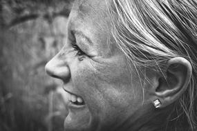 black and white portrait of a laughing woman