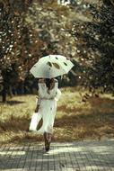 girl under an umbrella, view from the back