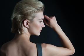 Portrait of the blonde woman with the fashionable hairstyle