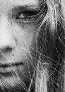 black and white portrait of a girl with freckles