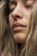 closeup picture of Face of young beautiful girl with closed eyes