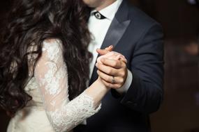 romantic bride and groom holding hands