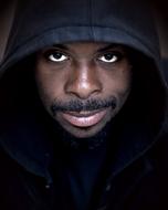 young african man in Hoodie, low key portrait