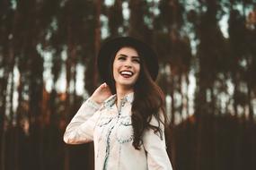 happy young woman in hat