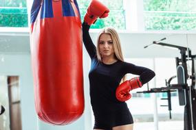 boxing girl in red gloves