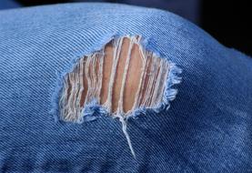 hole in jeans close-up