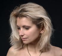 Portrait of the beautiful woman with blonde hair, wearing necklace