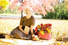 Young Woman on picnic at Fall