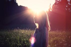 picture of a woman with sun backlight