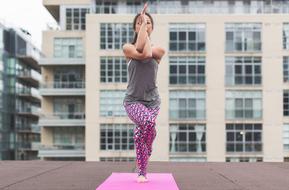 young woman in garudasana pose
