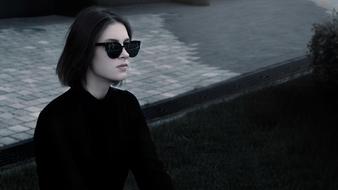 fashionable girl in black sunglasses