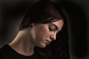 Portrait of sad young Woman, Side View