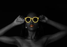 dark skin Woman with stylish glasses in yellow frame