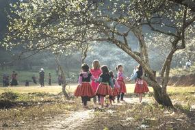 girls in suits on the field in vietnam