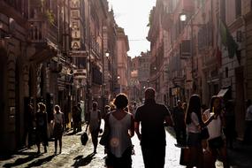 People walking on historical street at evening, italy, naples