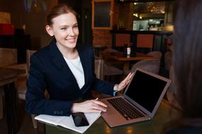 girl with laptop at a meeting in a cafe