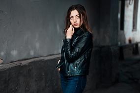 serious young Woman in black jacket