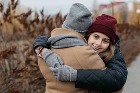 Family of Mom and Daughter hug