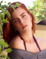 photo of a redhead girl in the garden