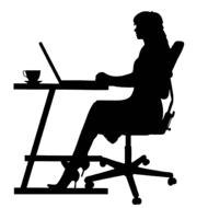 silhouette of a businesswoman at desk