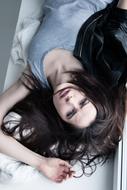 long hair brunette Girl laying on her back