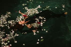 floating woman in flower petals