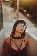 stylish girl in sunglasses on a blurred background