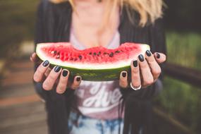 piece of Watermelon in female hands