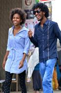 Happy young African Couple walking in city