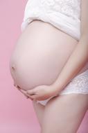 Pregnant Women on pink background