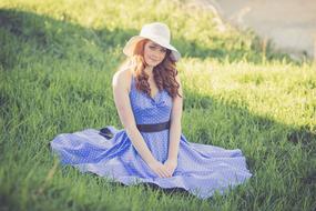 woman in blue dress on the meadow