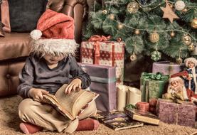 little boy under Christmas tree