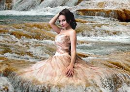 young woman il long dress posing in water stream, collage