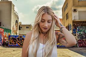 tattooed young woman in boho style